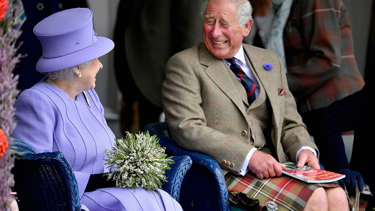 "The Queen was spotted cracking a rarely seen smile at the Braemar Gathering ...as she shared a joke with her son Prince Charles - who was decked-out in a kilt."